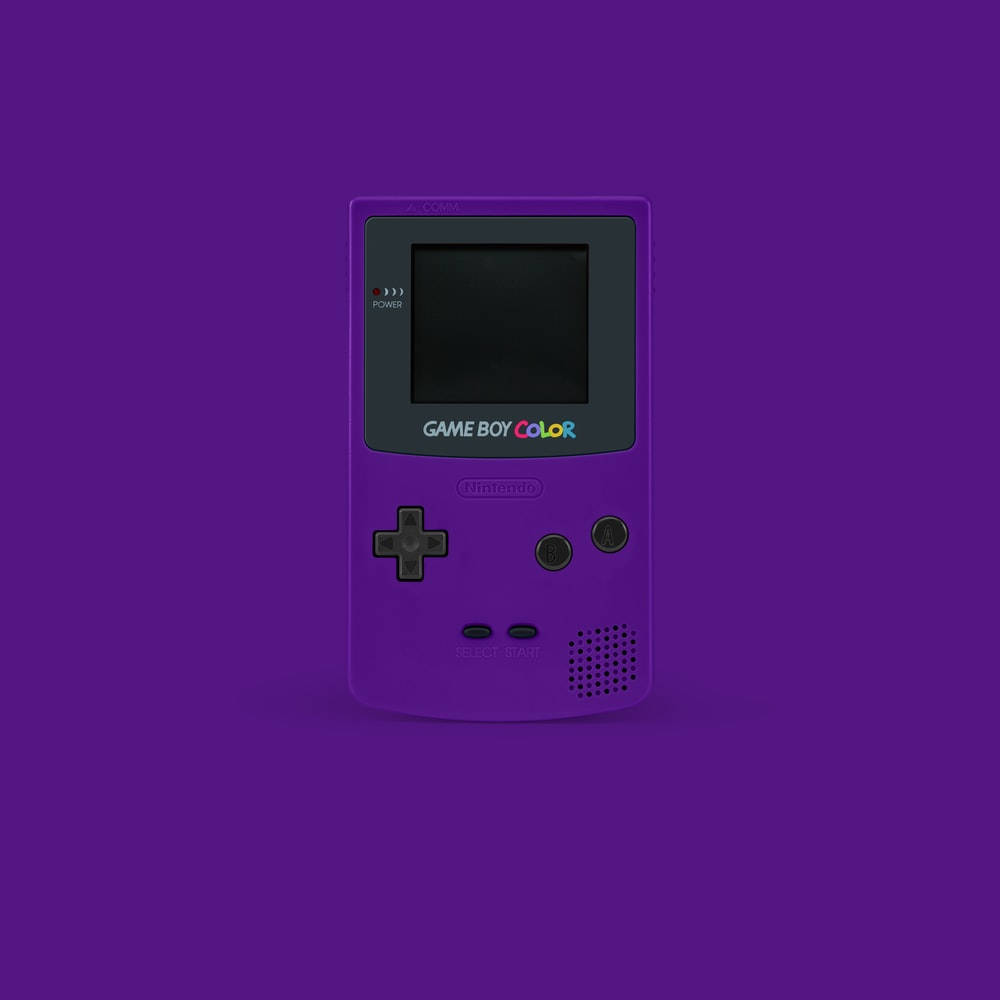 קונסולת משחקים כף יד רטרו בצבע סגול - Game Boy Color טפט
